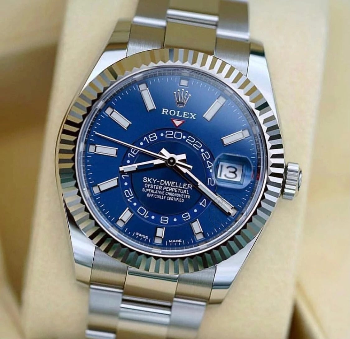 Oyster Perpetual Sky-Dweller in White Rolesor with a bright blue dial and an Oyster bracelet. RLX Sky-Dweller RLX-DWELLER