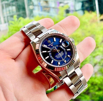Oyster Perpetual Sky-Dweller in White Rolesor with a bright blue dial and an Oyster bracelet. RLX Sky-Dweller RLX-DWELLER